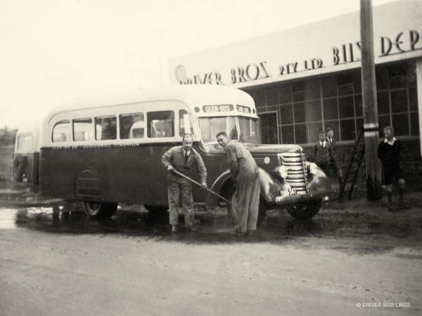 Eric and Reg Driver washing 1938 Federal Bus outside Driver Bros bus depot in glen iris (vintage photo)